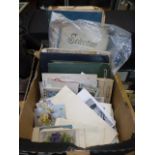 A tray containing postcards, photographs, sheet music etc.