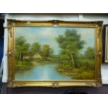 A ornate gilt framed oil on canvas of a river running through wood scene with cottage signed bottom