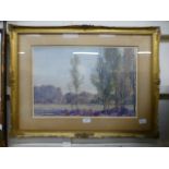 A gilt framed and glazed watercolour of a country home signed Rushton