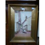 A framed and glazed watercolour of continental street scene signed bottom left Barton
