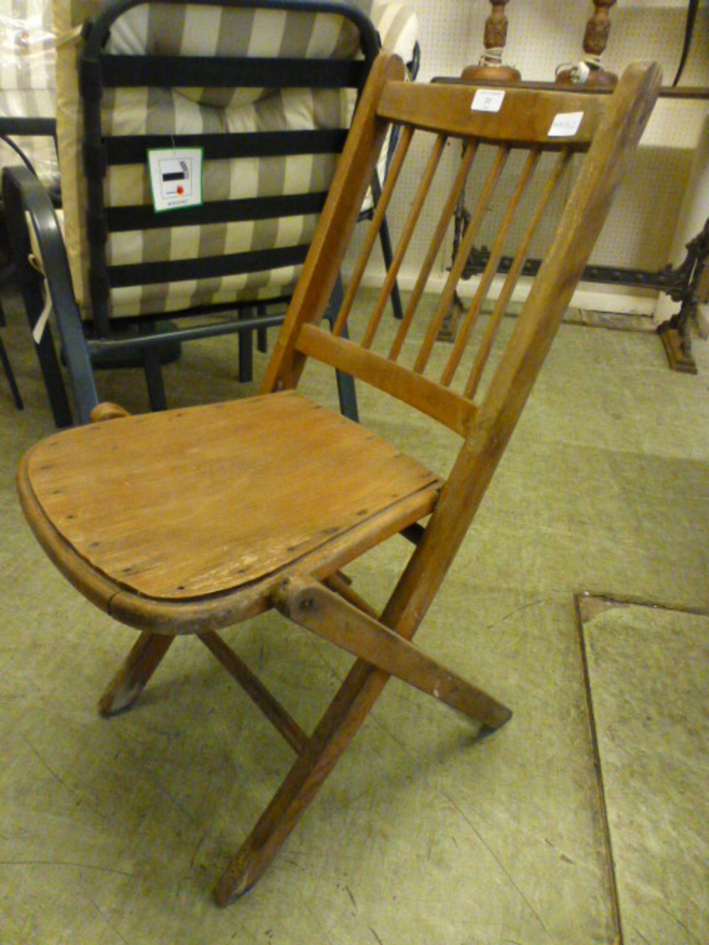An early 20th century beech folding chair