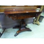 A Victorian rosewood veneered fold over games table CONDITION REPORT: Split through