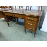 An early 20th century oak desk having three drawers by single drawer CONDITION REPORT: