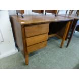 A mid-20th century teak desk with three drawers and hidden cupboard by Remploy CONDITION