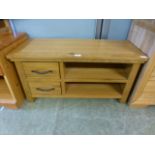 A modern oak low level stand with drawers and open storage