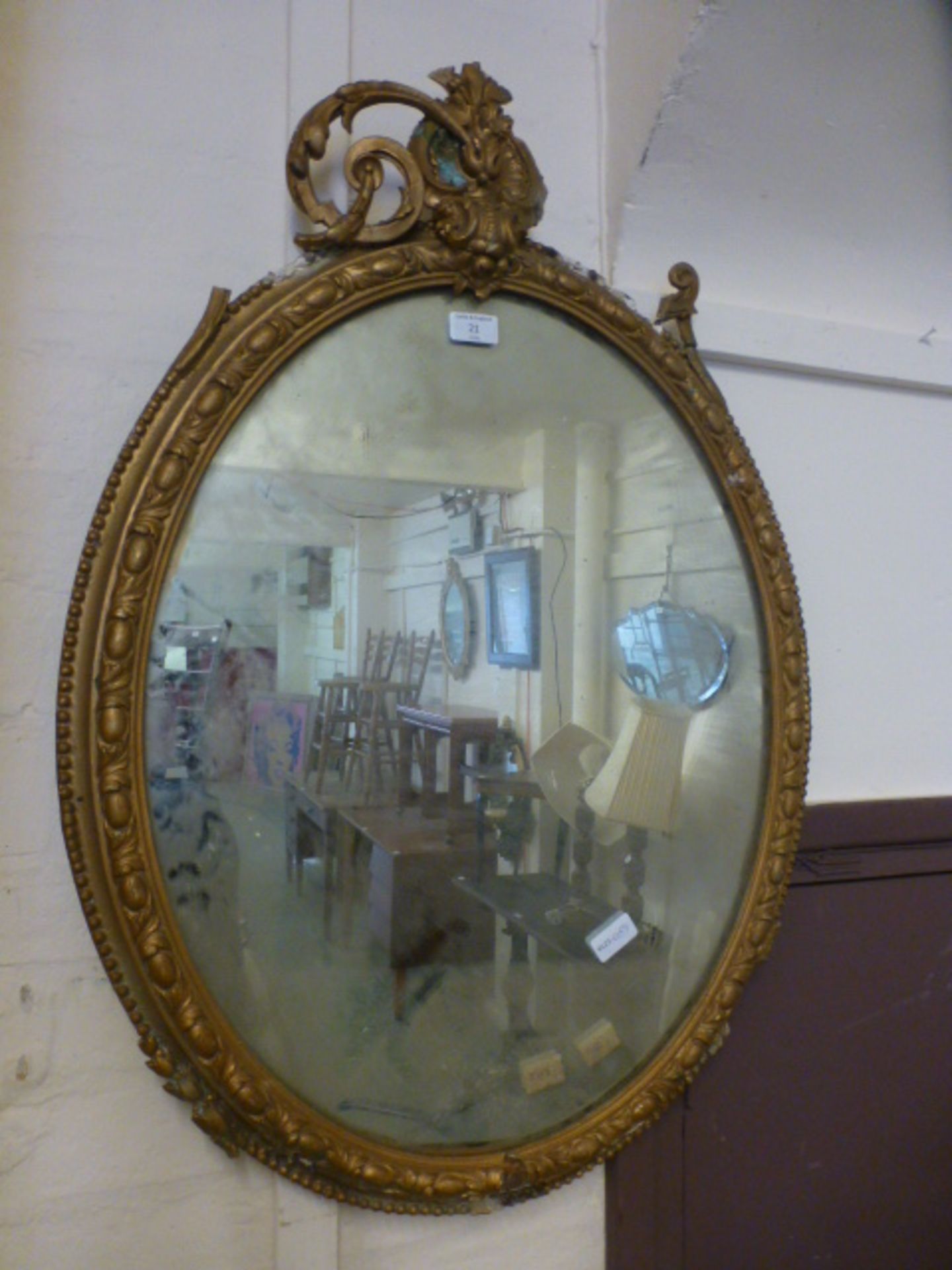 A gilt framed oval mirror A/F