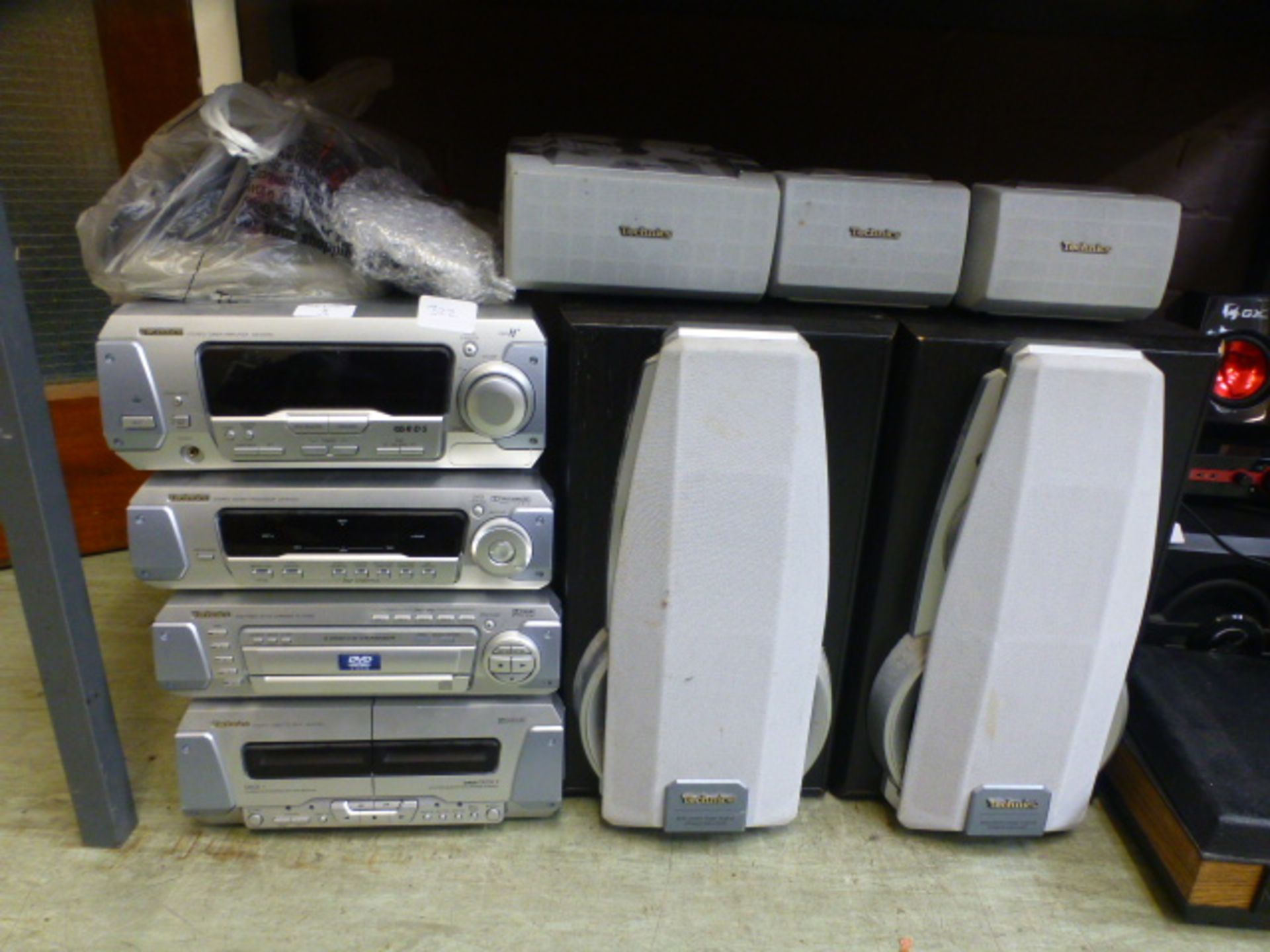 A Technics stacking Hi-fi system along with five speakers