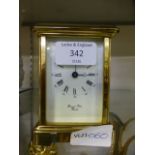 A 20th century brass carriage clock signed to dial