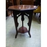 An early 20th century mahogany occasional table with under tier