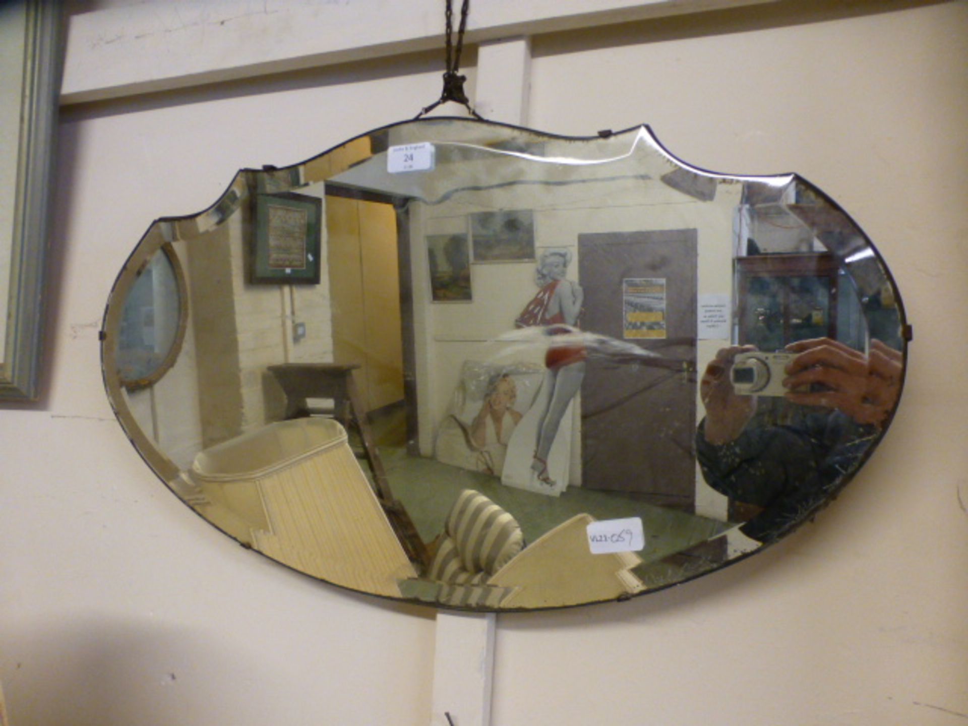 An early 20th century bevelled glass mirror