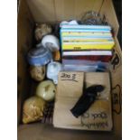 A large box containing children's annuals, religious figures, glassware etc.