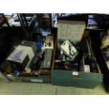 Two trays of boxed and unboxed small electrical items