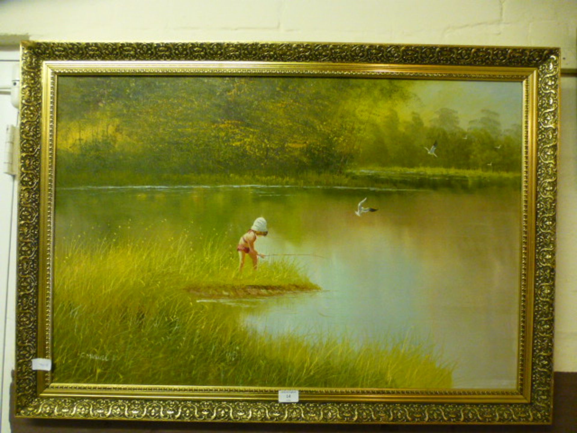 A gilt framed oil on canvas of child fishing signed Manuel