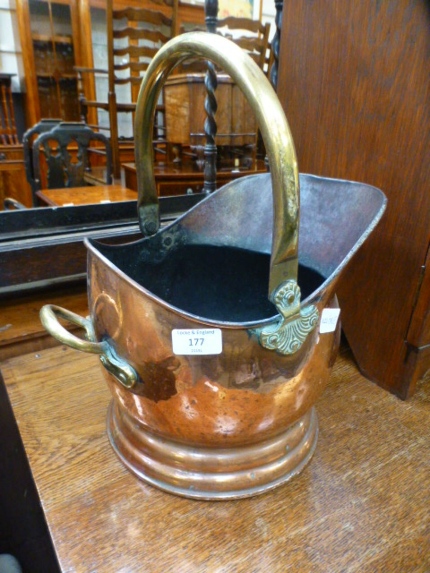 A brass and copper coal bucket