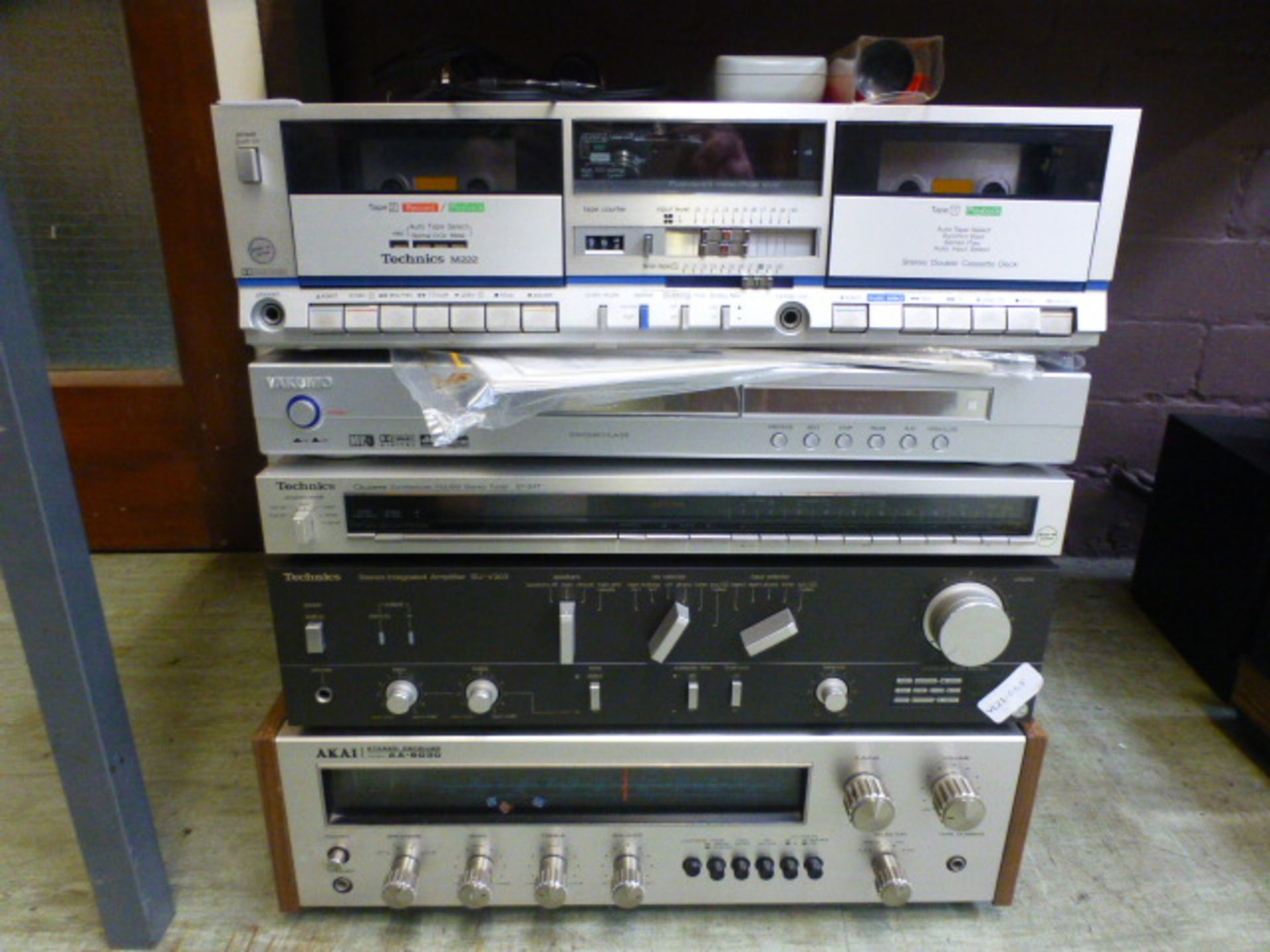 A Technics amplifier and tuner along with an Akai receiver, technics tape deck etc.