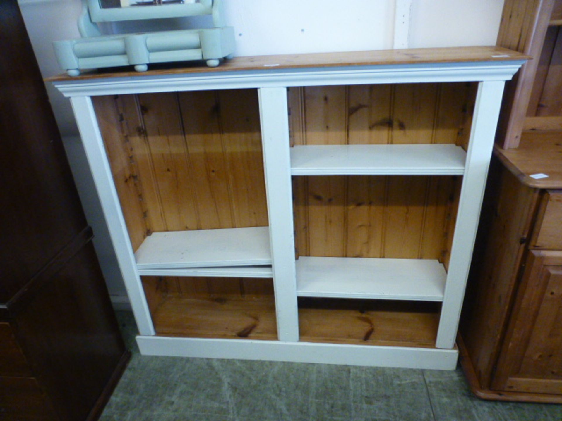 A pine and painted adjustable bookcase