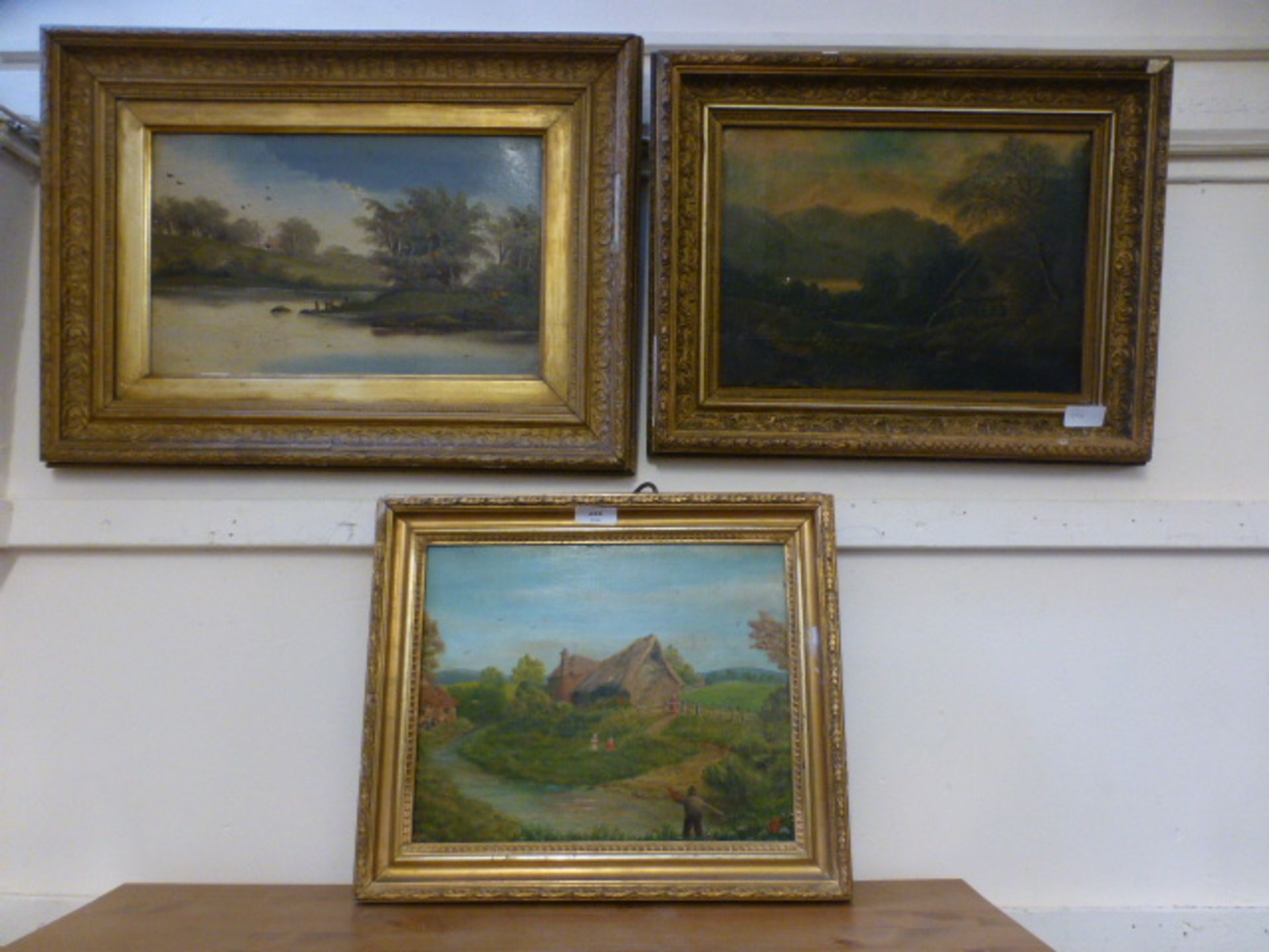 Three gilt framed oils of countryside