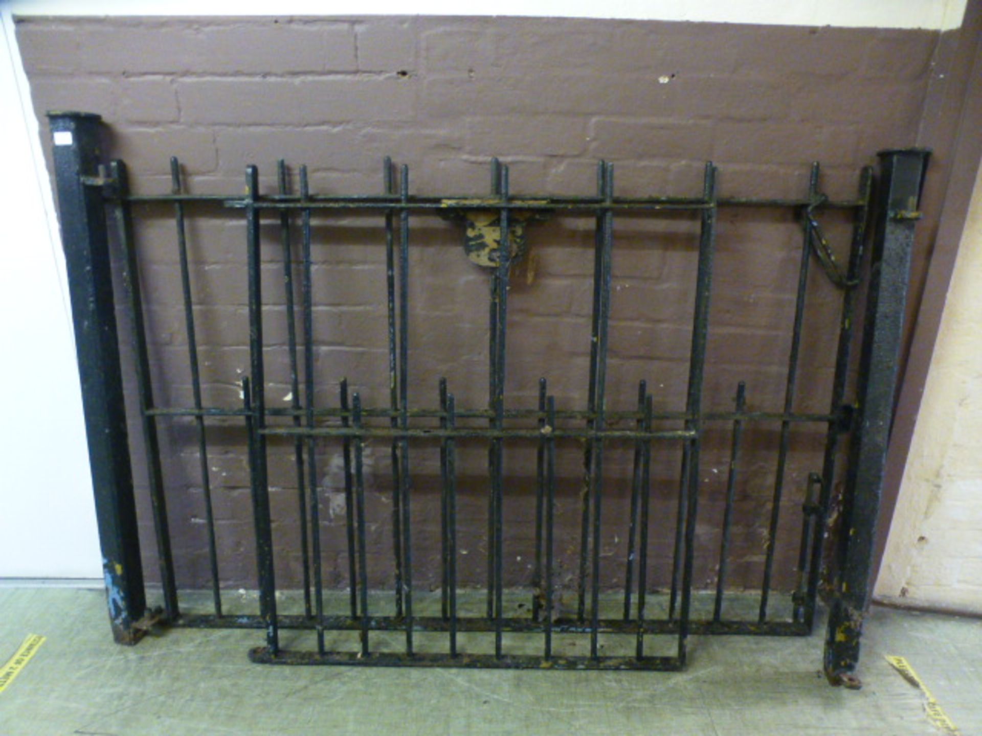 A black painted iron double gate