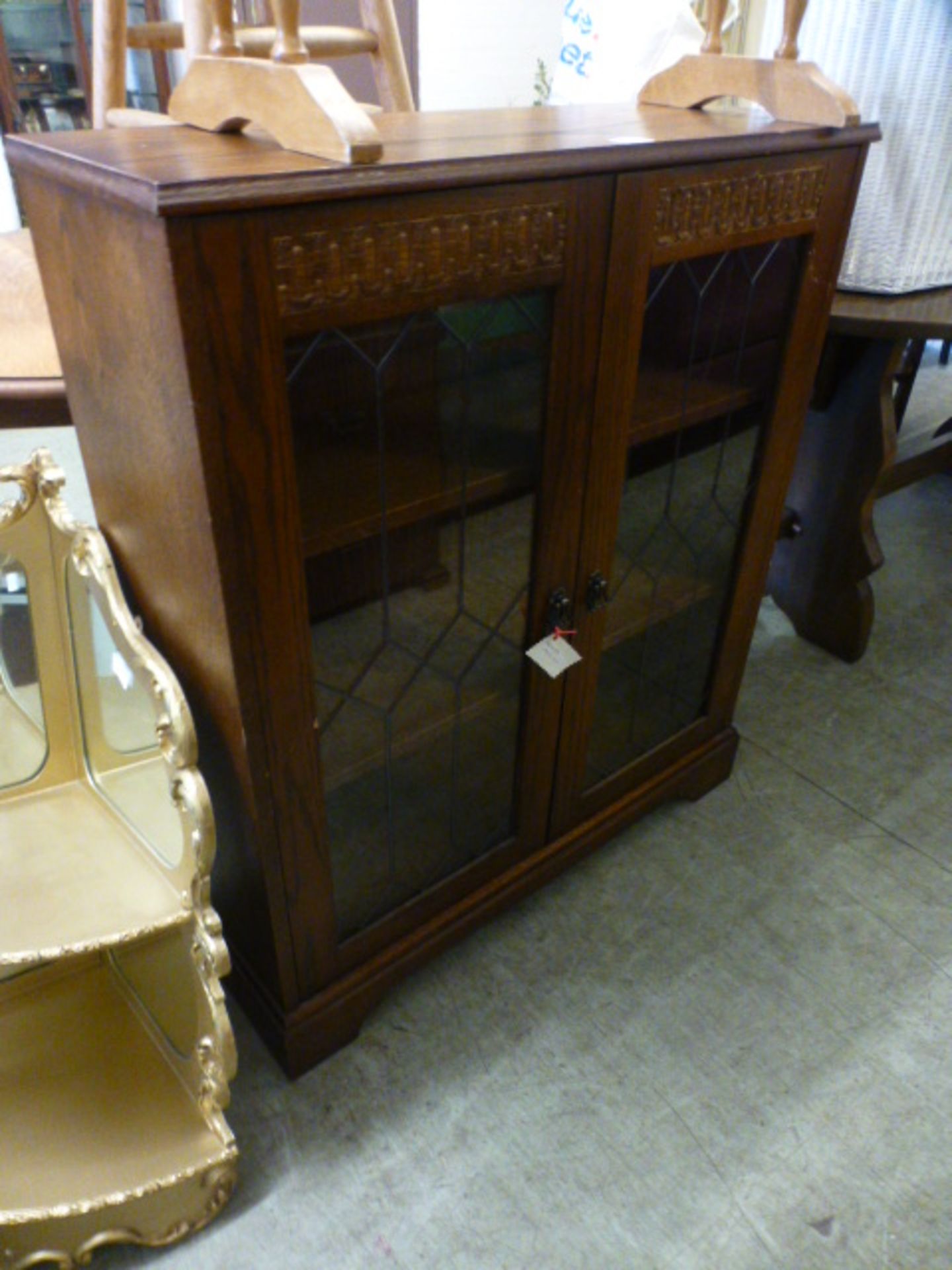 An oak veneered two door bookcase