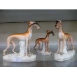 Three 19th century Staffordshire figures of greyhounds with hares