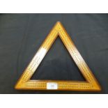 A boxwood and triangular cribbage board