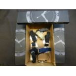 A box containing a quantity of military style watches