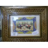 A framed Persian hunting scene