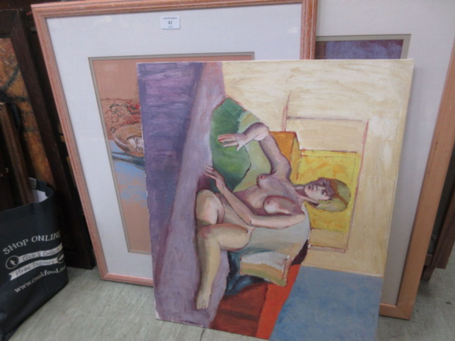 Two framed and glazed pastels of nudes along with one unframed