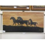An oil of canvas of silhouetted horses signed bottom right