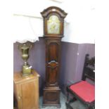 A reproduction oak cased granddaughter clock with Westminster chimes