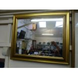 A modern gilt framed wall mirror