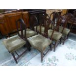 A set of six Georgian dining chairs together with one similar