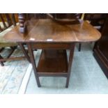 A mid-20th century drop-leaf table with under tier