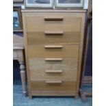 A modern oak chest of six long drawers