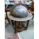 A reproduction globe drinks cabinet