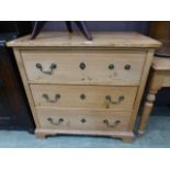 A waxed pine chest of three long drawers