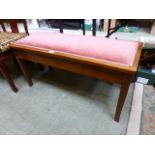 An early 20th century mahogany duet music stool with lift up lid