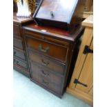 A reproduction mahogany two drawer filing cabinet with put-out slide to top