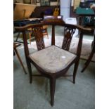 An early 20th century mahogany inlaid corner chair