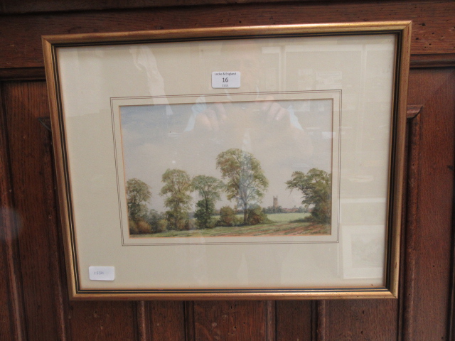 A framed and glazed watercolour of country scene with church in foreground signed John Killingback