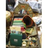 A box containing an assortment of items to include books, mirror, ornaments etc.