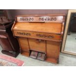 A Edwardian walnut American organ