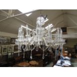 An impressive early 20th century sixteen branch cut glass chandelier, h.74 cm, dia.