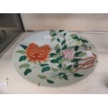 An early 20th century Chinese charger decorated with flowers CONDITION REPORT: No