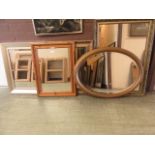 A selection of five framed wall mirrors