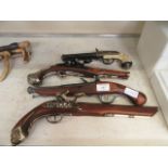 Four reproduction flintlock pistols