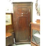 An 18th century and later mahogany floor standing corner cupboard, h. 198 cm, w.