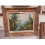 An ornate gilt framed oil of stream in wooded scene