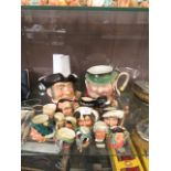 An assortment of Royal Doulton and other character jugs to include 'The Falconer', 'Merlin',