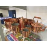 A selection of copper ware to include planter, kettle, tankard etc.